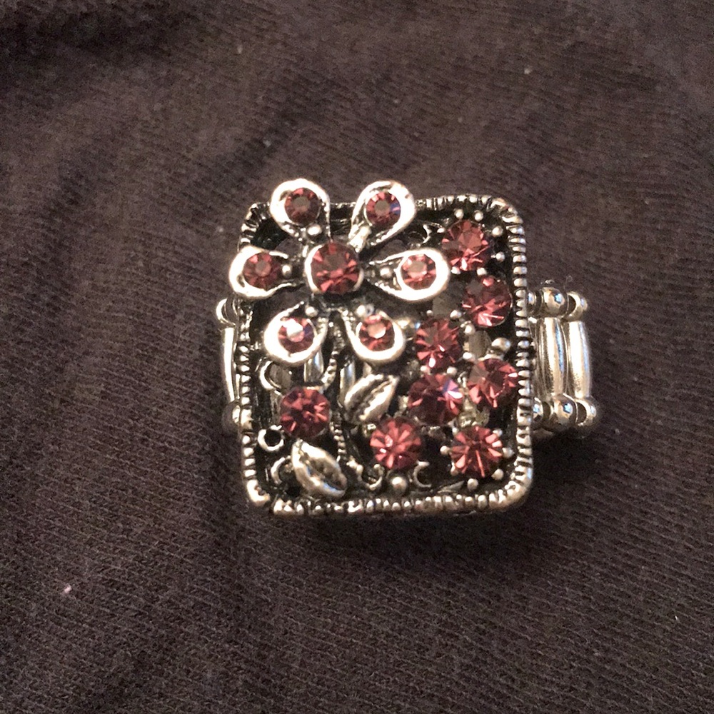 Silvertone ring with pink stones